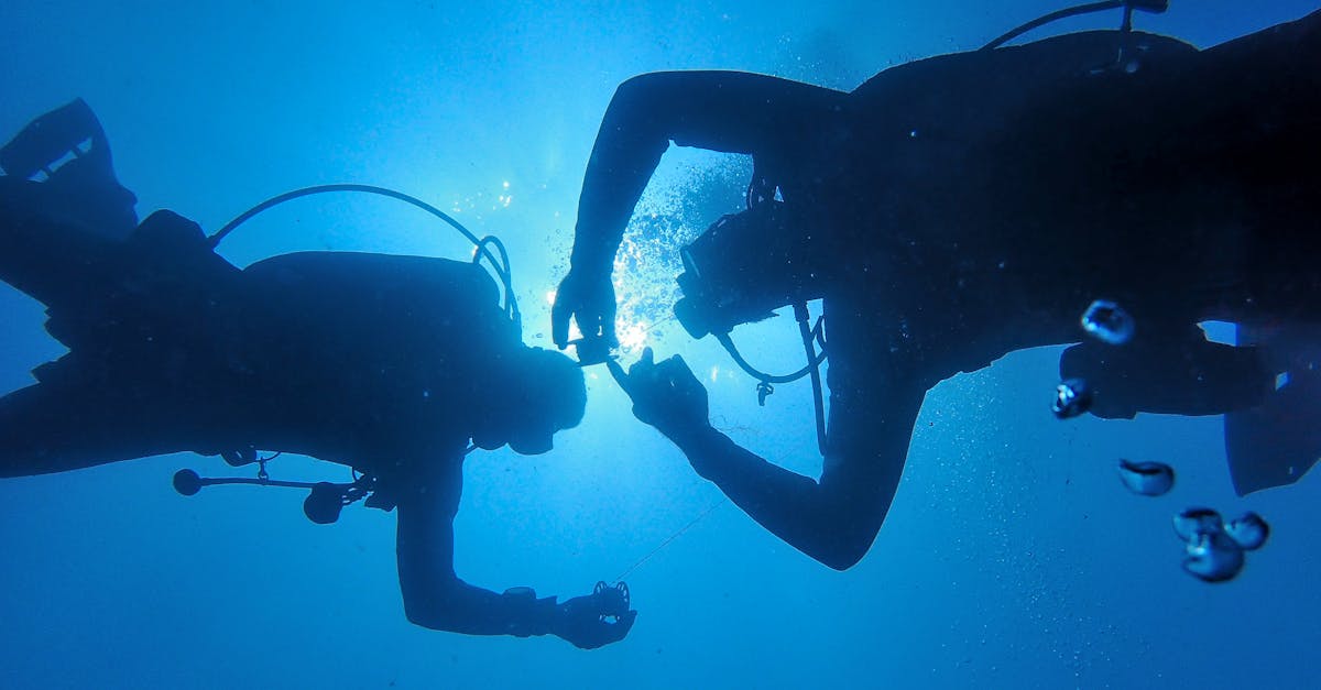 Dive course planning materials beside scuba gear.