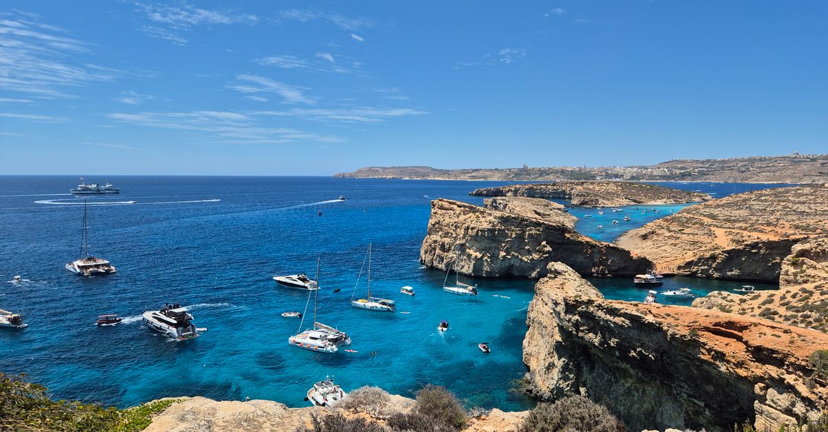 Malta diving guide hero image of a Mediterranean limestone coastline with clear turquoise water.